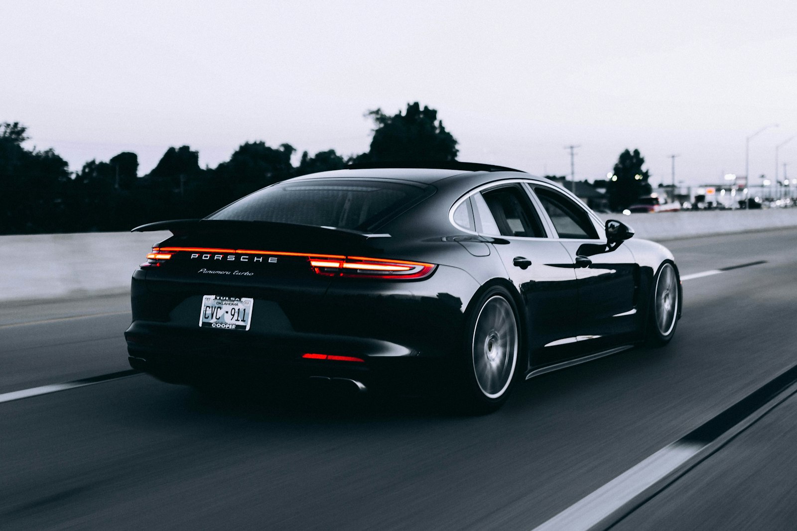 Sports car driving on an open road