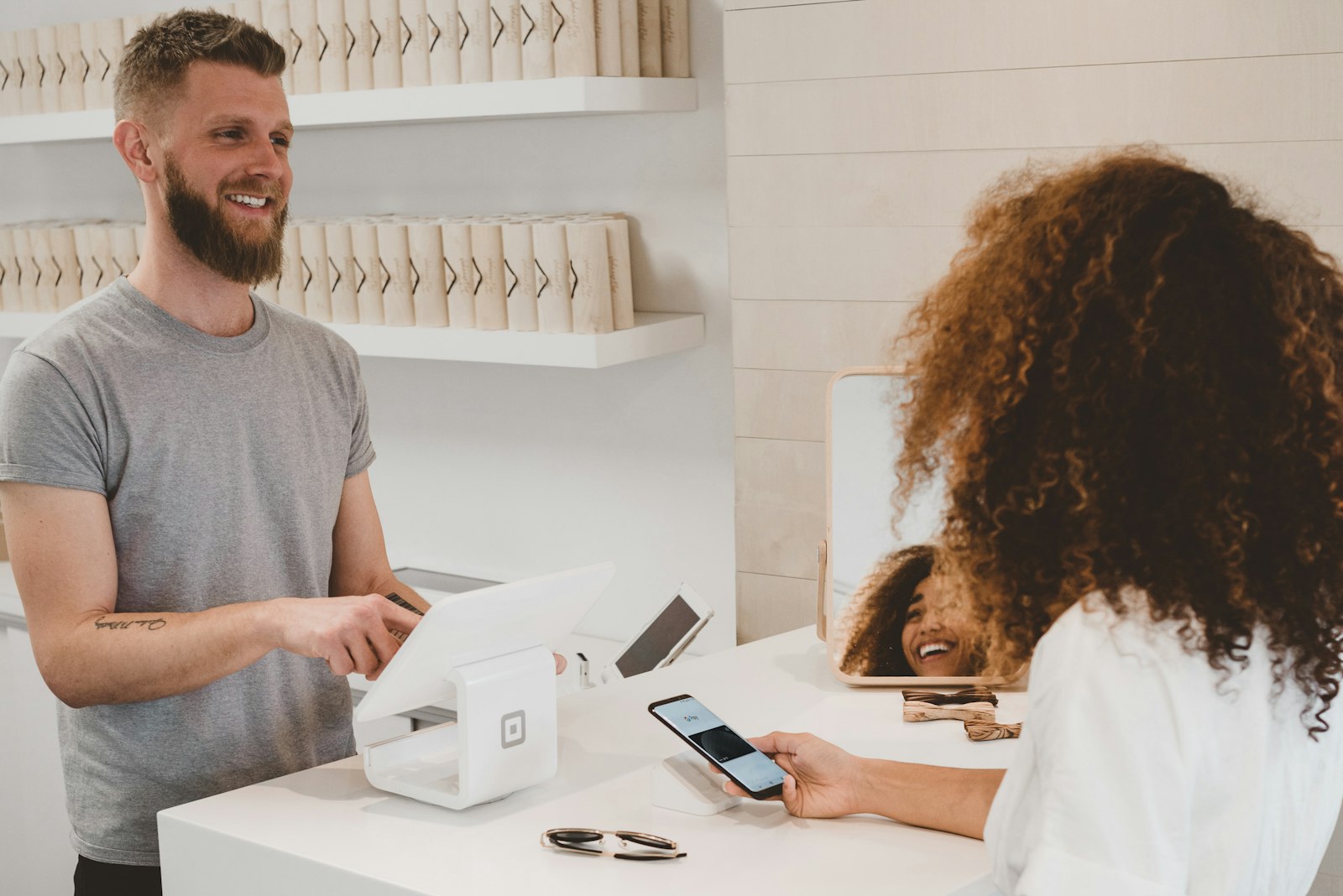 Customer paying with a smartphone using mobile banking